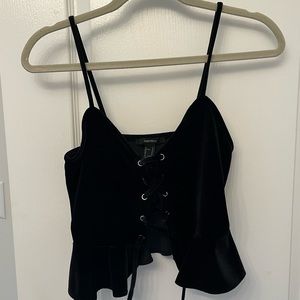 Black velvet cropped top. Ties in the front. Never worn.